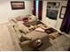 Large basement living room featuring a comfortable sectional sofa, TV, and carpeted floors at 10118 Leeward Blvd, Indianapolis, IN 46256