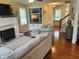 Comfortable living room with fireplace, built-in shelving and stairs to the second floor at 10118 Leeward Blvd, Indianapolis, IN 46256