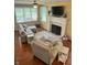 Cozy living room with fireplace and windows allowing natural light at 10118 Leeward Blvd, Indianapolis, IN 46256