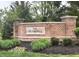 Charming brick community entrance sign that reads 'The Moorings' with manicured landscaping at 10118 Leeward Blvd, Indianapolis, IN 46256