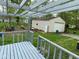 View from the deck featuring a backyard and detached garage with white siding at 10361 E 30Th St, Indianapolis, IN 46229