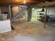 Unfinished basement with concrete walls and floor, stairs to upper level and visible utilities at 10361 E 30Th St, Indianapolis, IN 46229