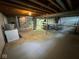 This large unfinished basement offers great potential with concrete floor and visible beams at 10361 E 30Th St, Indianapolis, IN 46229