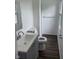 Bathroom with gray vanity, modern sink, toilet, and a bright window at 10361 E 30Th St, Indianapolis, IN 46229