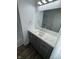 Bathroom with vanity, bright lighting, and large mirror at 10361 E 30Th St, Indianapolis, IN 46229