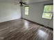 Spacious bedroom features two windows, modern flooring and neutral colored walls at 10361 E 30Th St, Indianapolis, IN 46229