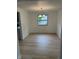 Dining room features wood floors, a window, and a light fixture at 10361 E 30Th St, Indianapolis, IN 46229