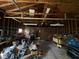 Unfinished detached garage interior showing exposed framing, and ample room for storage at 10361 E 30Th St, Indianapolis, IN 46229