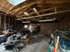Spacious detached garage interior showcasing exposed wood framing, and ample storage space at 10361 E 30Th St, Indianapolis, IN 46229