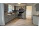 Updated kitchen featuring stainless steel appliances, granite counters and ample storage at 10361 E 30Th St, Indianapolis, IN 46229