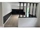Cozy living room with wood floors and a black painted fireplace at 10361 E 30Th St, Indianapolis, IN 46229