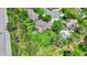 An aerial view of a home featuring a well-manicured lawn and an outdoor seating area with a yellow umbrella at 10882 Camden Ct, Fishers, IN 46038