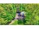 Aerial view of a playground and basketball court in a serene, wooded neighborhood at 10882 Camden Ct, Fishers, IN 46038