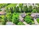 Aerial view of homes surrounded by mature trees and green landscaping at 10882 Camden Ct, Fishers, IN 46038