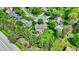 Aerial view of a home with a well-kept lawn, patio area, and lush greenery at 10882 Camden Ct, Fishers, IN 46038