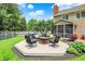 Spacious backyard featuring a wooden deck with lounge seating and a manicured lawn and landscaping at 10882 Camden Ct, Fishers, IN 46038