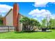 Large, grassy backyard with a deck, mature trees, and fenced perimeter at 10882 Camden Ct, Fishers, IN 46038