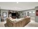 Spacious basement featuring a large sectional sofa and entertainment center at 10882 Camden Ct, Fishers, IN 46038