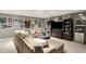 Finished basement with sports memorabilia and large sectional sofa at 10882 Camden Ct, Fishers, IN 46038