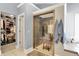 Beautiful bathroom with a tiled walk-in shower featuring a glass door and a spacious walk-in closet at 10882 Camden Ct, Fishers, IN 46038
