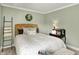 Well-decorated bedroom with an upholstered headboard, and decorative pillows creating a warm and inviting space at 10882 Camden Ct, Fishers, IN 46038