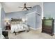 Vaulted bedroom with blue walls, ceiling fan, and carpeted floors at 10882 Camden Ct, Fishers, IN 46038