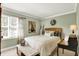 Cozy bedroom featuring a comfortable bed, a bright window, and tasteful decor, creating a relaxing atmosphere at 10882 Camden Ct, Fishers, IN 46038