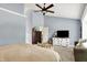 Large bedroom featuring modern dresser, ceiling fan, and plush bedding at 10882 Camden Ct, Fishers, IN 46038