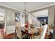 Dining area with stylish chandelier and view of the home's stairwell and Gathering room at 10882 Camden Ct, Fishers, IN 46038