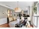 Dining area with seating for four and view into the modern kitchen at 10882 Camden Ct, Fishers, IN 46038
