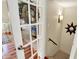 Inviting entryway with decorative wreath on glass door and staircase at 10882 Camden Ct, Fishers, IN 46038
