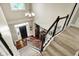 Bright foyer features hardwood floors, elegant lighting, and a welcoming front door at 10882 Camden Ct, Fishers, IN 46038