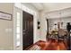 Welcoming foyer with hardwood floors, a decorative rug, and views into the dining room at 10882 Camden Ct, Fishers, IN 46038