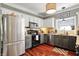 Modern kitchen with stainless steel appliances, tile backsplash, and a beautiful countertop at 10882 Camden Ct, Fishers, IN 46038