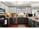 The kitchen features granite countertops, stainless steel appliances, and lots of natural light at 10882 Camden Ct, Fishers, IN 46038