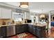 Well-lit kitchen features stainless steel appliances, granite countertops, and lots of storage at 10882 Camden Ct, Fishers, IN 46038