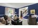 Spacious living room with hardwood floors, blue walls, and an open floor plan at 10882 Camden Ct, Fishers, IN 46038