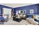 Cozy living room featuring a leather sofa, accent chairs, and stylish decor at 10882 Camden Ct, Fishers, IN 46038