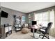 Home office with neutral colors, bright windows, a modern desk, and a comfortable ergonomic chair at 10882 Camden Ct, Fishers, IN 46038