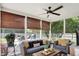 Cozy screened-in porch featuring comfortable seating and views of the backyard at 10882 Camden Ct, Fishers, IN 46038
