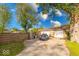 Spacious driveway leading to a two-car garage, with mature trees adding shade at 109 N Avon Ave, Avon, IN 46123