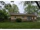 Cozy single-story home with a stone foundation, neutral siding, and a well-manicured green lawn at 109 N Avon Ave, Avon, IN 46123