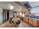 Functional kitchen with wood cabinets, stainless steel appliances, and a casual dining space at 109 N Avon Ave, Avon, IN 46123