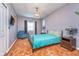 Comfortable bedroom with bright colored bedding, plush rug, and cozy accents at 10935 Cornell St, Carmel, IN 46280