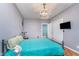 Comfortable bedroom with bright bedding and carpet at 10935 Cornell St, Carmel, IN 46280