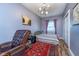 Bedroom with carpet, leather chair, and lots of light at 10935 Cornell St, Carmel, IN 46280