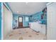 Functional laundry room featuring a sink, washer, dryer, storage shelves and tiled floors at 10935 Cornell St, Carmel, IN 46280