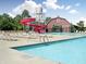 Community pool with water slide, barn, and plenty of lounge chairs for residents to enjoy at 11315 N Quillow Way, Monrovia, IN 46167