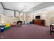Fun basement features a unique theme, cozy chair, and vibrant colors at 11780 Pebblepointe Pass, Carmel, IN 46033