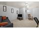 Basement with textured walls, plush carpet, and comfortable seating at 11780 Pebblepointe Pass, Carmel, IN 46033